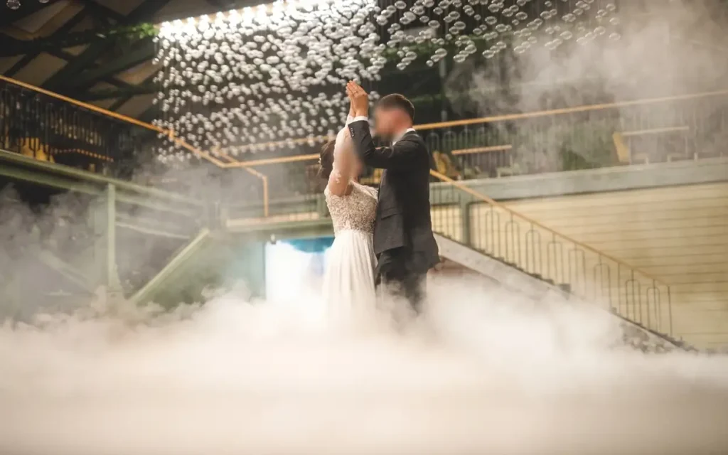 Bride and groom dancing surrounded by dry ice low fog heavy smoke effect for weddings and celebrations in Riyadh - VOG ICE
